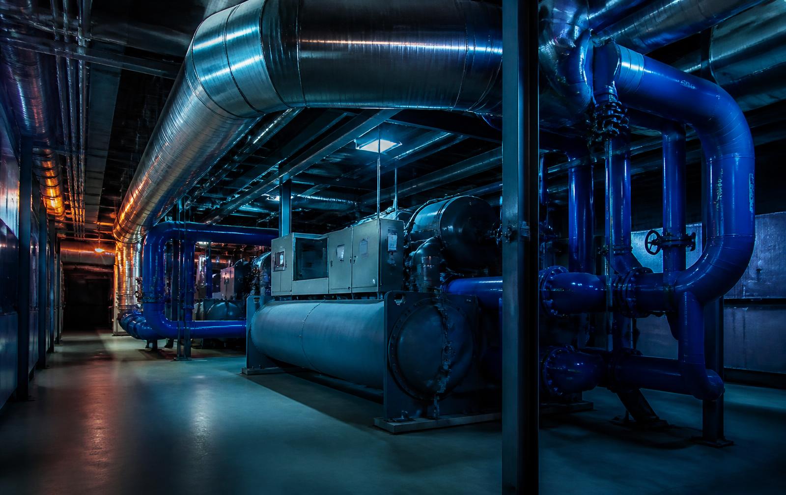 Chilled water piping and ductwork in a commercial mechanical room